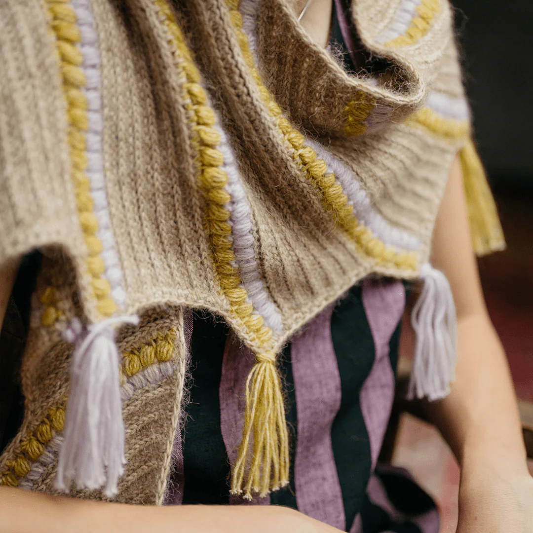 1451-calendula-shawl-wrap-with-bobbles-and-fringe-1.webp