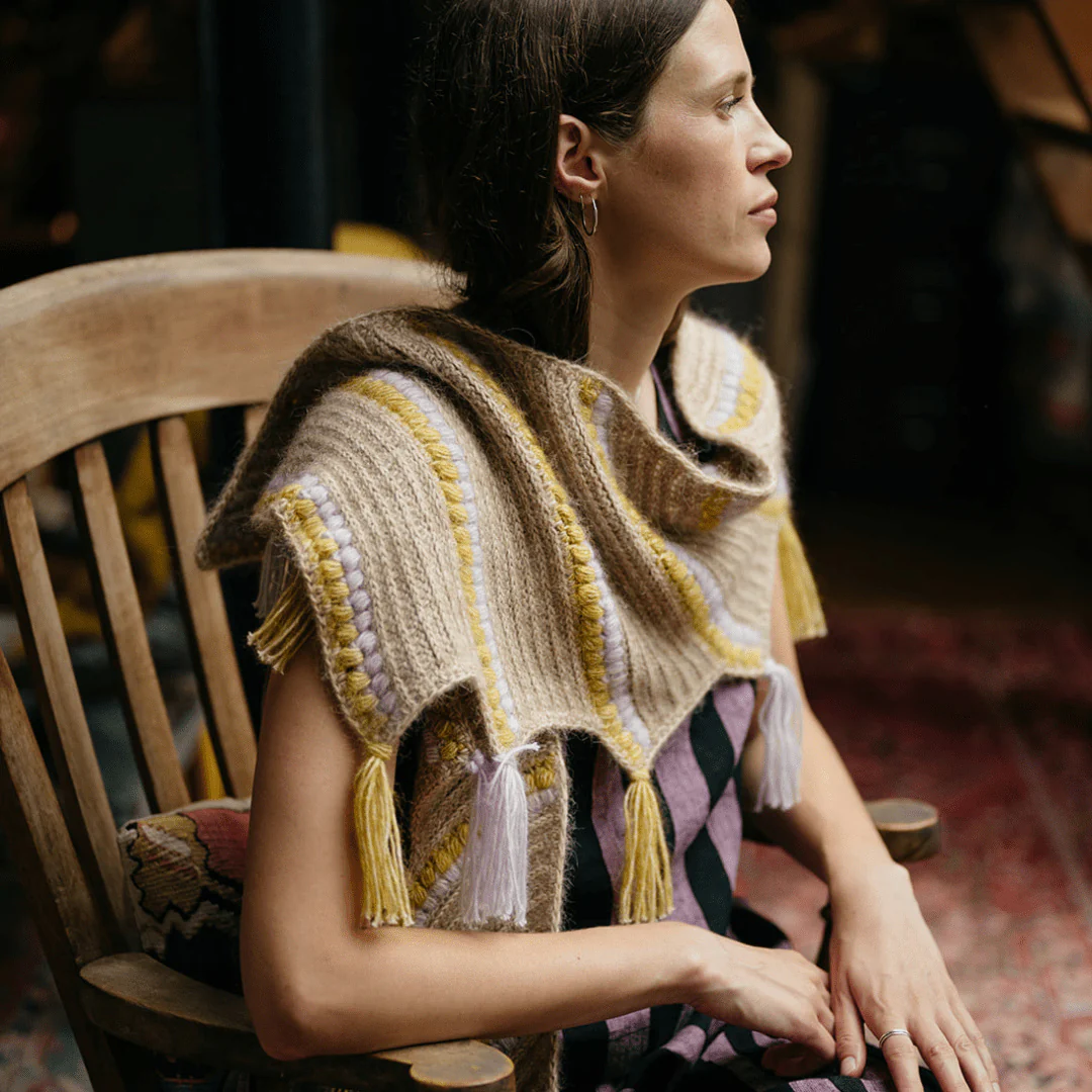 1451-calendula-shawl-wrap-with-bobbles-and-fringe-1.webp