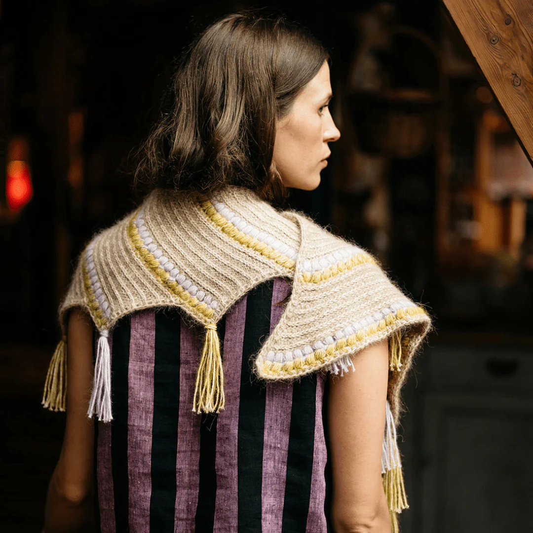 1451-calendula-shawl-wrap-with-bobbles-and-fringe-1.webp