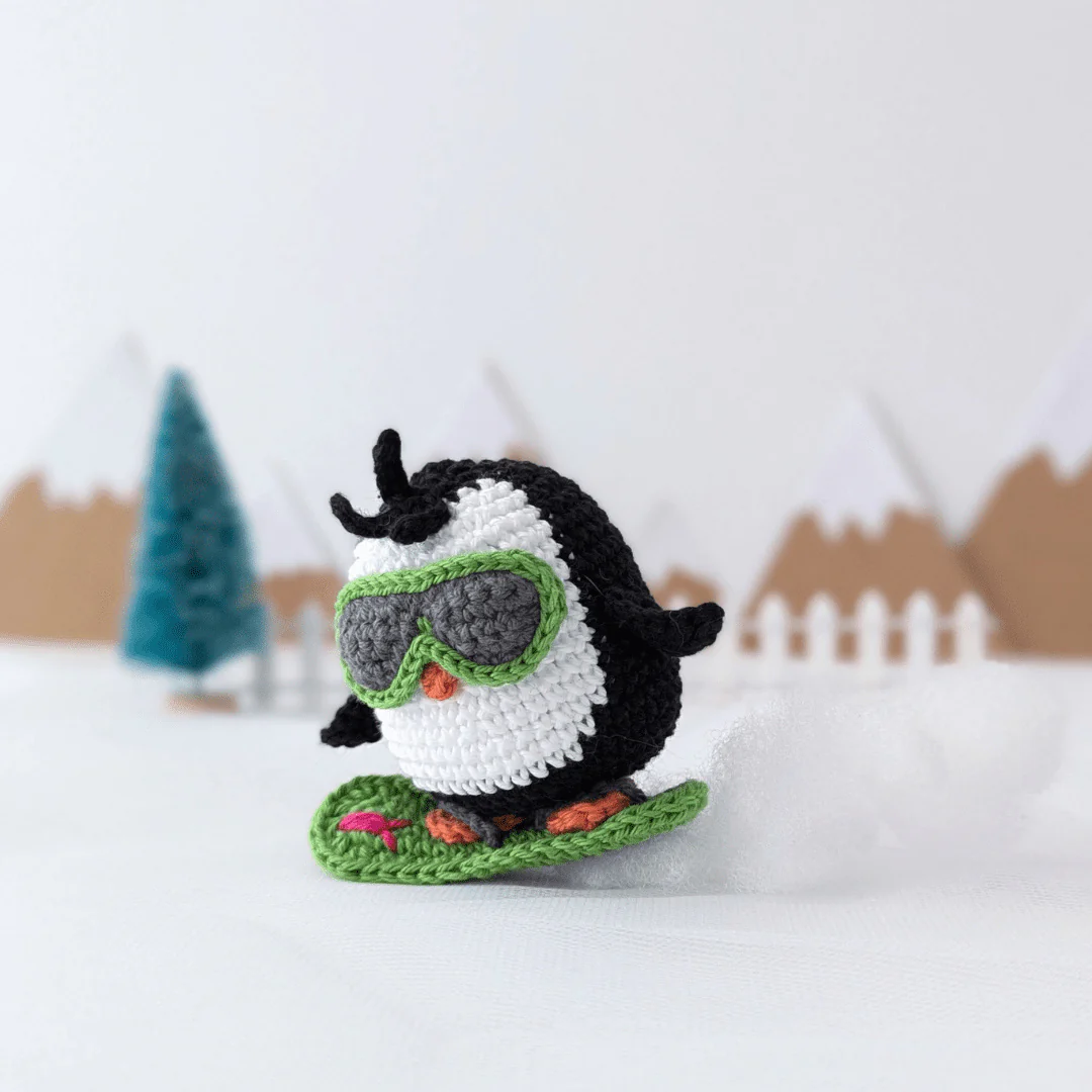 5877-brady-the-snowboarding-penguin-1.webp