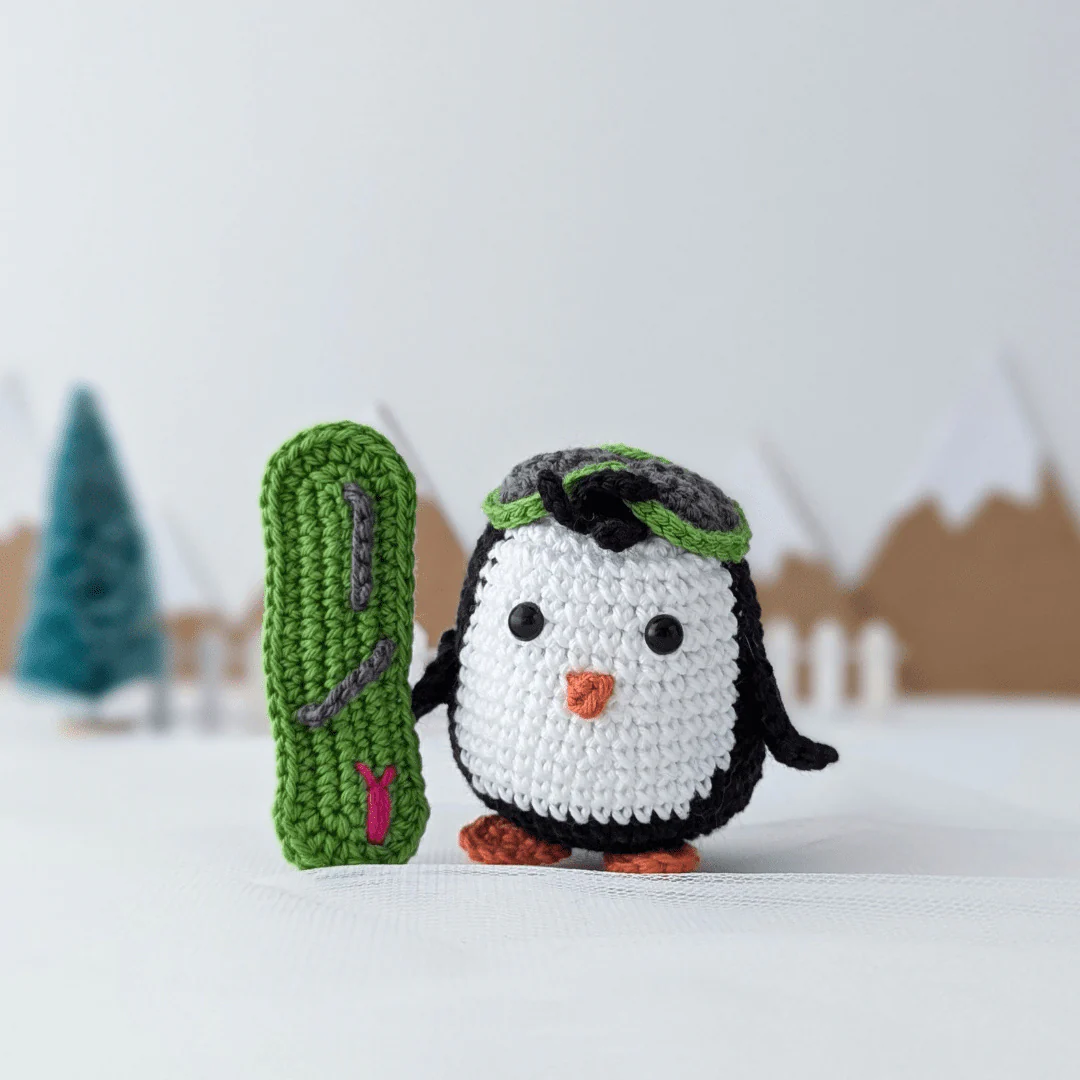 5877-brady-the-snowboarding-penguin-1.webp